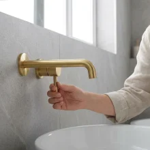 Pomeranian-Brushed-Brass-Wall-Mounted-Basin-Tap-life1.webp