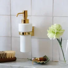 Smedbo-House-Porcelain-Soap-Dispenser-with-Polished-Brass-Holder-Lifestyle-2.webp