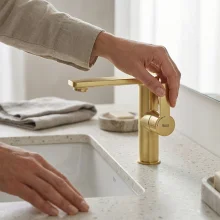 roca-targa-brushed-brass-basin-mixer-tap-with-side-handle-waste-lifestyle.webp