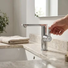 roca-targa-stainless-steel-finish-basin-mixer-tap-with-side-handle-waste-lifestyle.webp